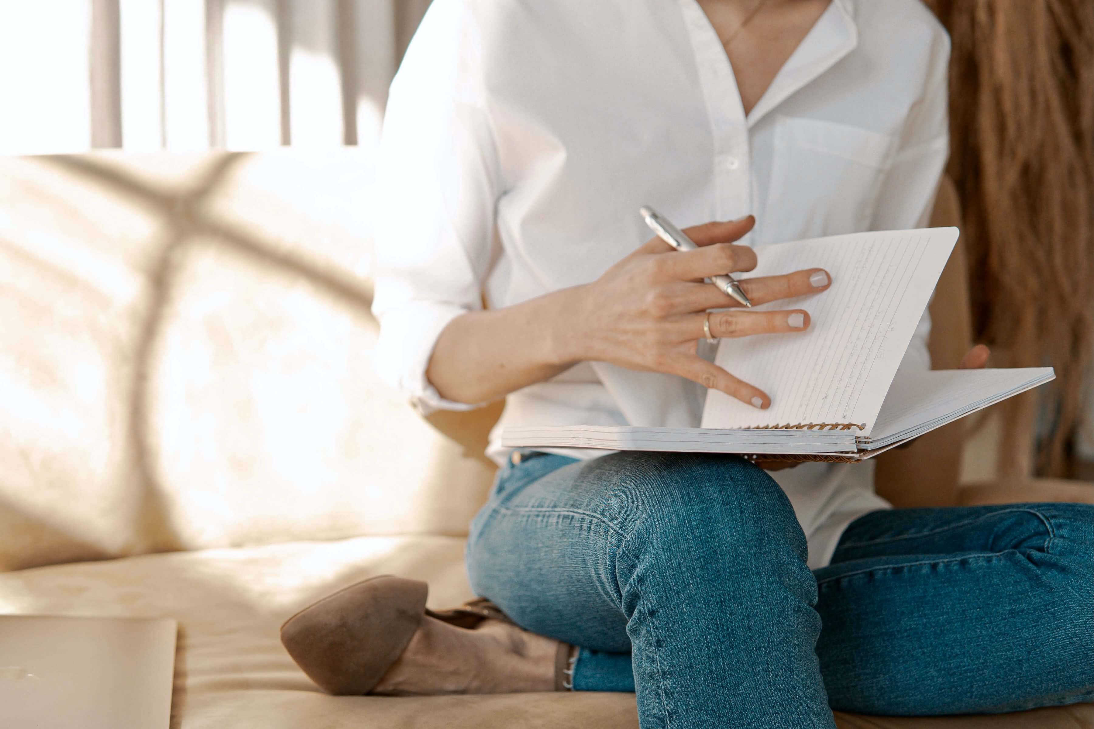 Woman writing in a notebook